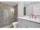 Modern bathroom featuring a glass shower and elegant gold fixtures at 4800 Timberland Sw Dr, Mableton, GA 30126