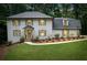 Beautiful two-story home with a well-manicured lawn and landscaping at 4800 Timberland Sw Dr, Mableton, GA 30126