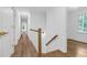 Hallway with hardwood floors and natural light at 4800 Timberland Sw Dr, Mableton, GA 30126