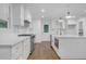 Modern kitchen with white cabinets, stainless steel appliances, and quartz countertops at 4800 Timberland Sw Dr, Mableton, GA 30126