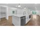 Open-concept kitchen with a large island, stainless steel appliances, and hardwood floors at 4800 Timberland Sw Dr, Mableton, GA 30126