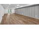 Large living room boasts vinyl flooring, recessed lighting, and a stylish gray accent wall at 4800 Timberland Sw Dr, Mableton, GA 30126