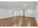 Large living room illuminated by recessed lighting and natural light, showcasing hardwood floors at 4800 Timberland Sw Dr, Mableton, GA 30126