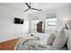 Bedroom with two windows, ceiling fan, and hard wood floors at 1253 Caroline Ne St # 223, Atlanta, GA 30307