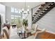Dining area with glass table, hardwood floors, and views of living area and outdoor space at 1253 Caroline Ne St # 223, Atlanta, GA 30307