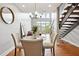 Dining area showcasing hardwood floors, contemporary chandelier, and open layout to living room at 1253 Caroline Ne St # 223, Atlanta, GA 30307