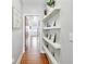 Hallway with decorative shelves and hardwood floors at 1253 Caroline Ne St # 223, Atlanta, GA 30307