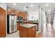 Open-concept kitchen featuring stainless steel appliances, granite countertops, and kitchen island at 1253 Caroline Ne St # 223, Atlanta, GA 30307