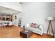 Open-concept living room with hardwood floors, high ceilings, and comfortable seating area at 1253 Caroline Ne St # 223, Atlanta, GA 30307