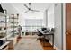 Bright loft office with built-in shelving and a ceiling fan at 1253 Caroline Ne St # 223, Atlanta, GA 30307