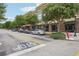 Charming street view with shops, street parking, and mature trees lining the sidewalks at 1253 Caroline Ne St # 223, Atlanta, GA 30307