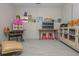 Finished basement featuring custom art, storage, and unique furniture at 2045 Bethany Spring Trce, Cumming, GA 30041