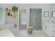 Elegant bathroom with a soaking tub, a glass-enclosed shower, and stylish fixtures for a spa-like feel at 2045 Bethany Spring Trce, Cumming, GA 30041