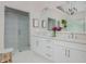 Bright bathroom with double vanity, glass shower, and modern fixtures for a luxurious feel at 2045 Bethany Spring Trce, Cumming, GA 30041