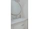 Bathroom vanity features white marble countertop, chrome faucet, and modern hardware at 2045 Bethany Spring Trce, Cumming, GA 30041