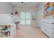 Bright bedroom with a loft bed, storage, and two large windows at 2045 Bethany Spring Trce, Cumming, GA 30041