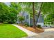Well-maintained home featuring gray siding, white trim, and a neatly manicured lawn at 2045 Bethany Spring Trce, Cumming, GA 30041