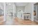 Spacious entry showcasing wood floors and natural light from large windows at 2045 Bethany Spring Trce, Cumming, GA 30041