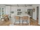 Updated kitchen with white cabinets, stainless steel appliances, and island seating at 2045 Bethany Spring Trce, Cumming, GA 30041