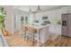 Modern kitchen with white cabinets, stainless steel appliances, and center island at 2045 Bethany Spring Trce, Cumming, GA 30041