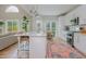 Contemporary kitchen featuring stainless steel appliances, white cabinets, and island dining at 2045 Bethany Spring Trce, Cumming, GA 30041