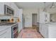 Modern kitchen with stainless steel appliances, white cabinets, and an open design for easy living at 2045 Bethany Spring Trce, Cumming, GA 30041