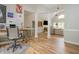Open-concept living room featuring modern decor, high ceilings and hardwood floors at 2045 Bethany Spring Trce, Cumming, GA 30041