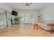 Open living area features a large sofa, TV, and bright windows at 2045 Bethany Spring Trce, Cumming, GA 30041