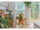 Bright living room featuring a decorative plant stand and lots of natural light at 2045 Bethany Spring Trce, Cumming, GA 30041
