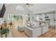 Open concept living room flows into a modern kitchen with stainless steel appliances at 2045 Bethany Spring Trce, Cumming, GA 30041