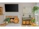Close-up of a stone fireplace in a cozy living room with plant decorations at 2045 Bethany Spring Trce, Cumming, GA 30041