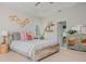 Tranquil bedroom with tray ceiling, decorative shelves, neutral tones, and a comfortable, stylish decor at 2045 Bethany Spring Trce, Cumming, GA 30041