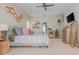 Stylish bedroom featuring tray ceiling, unique decor, and ample natural light for a serene retreat at 2045 Bethany Spring Trce, Cumming, GA 30041