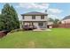 The home's back exterior features a deck and patio in the fenced yard at 402 Homestead Dr, Dallas, GA 30157