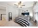 Cozy bedroom with natural lighting, ceiling fan, and stylish decor creates a comfortable and inviting retreat at 402 Homestead Dr, Dallas, GA 30157