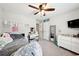 Cozy bedroom with white walls, ceiling fan, and stylish decor offers a comfortable personal space at 402 Homestead Dr, Dallas, GA 30157