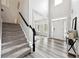 Inviting foyer with soaring ceilings, hardwood flooring, and staircase at 402 Homestead Dr, Dallas, GA 30157