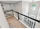 Upstairs hallway with railing overlooking the foyer and staircase at 402 Homestead Dr, Dallas, GA 30157