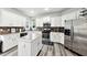 Stylish kitchen with white cabinets, stainless steel appliances, and a spacious center island at 402 Homestead Dr, Dallas, GA 30157