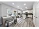 Bright kitchen featuring white cabinets, stainless steel appliances, and a large kitchen island at 402 Homestead Dr, Dallas, GA 30157