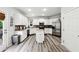 Modern kitchen with white cabinetry, stainless steel appliances, and center island with breakfast bar at 402 Homestead Dr, Dallas, GA 30157