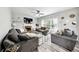 Cozy living room featuring a fireplace, modern lighting, and plush seating arrangement at 402 Homestead Dr, Dallas, GA 30157