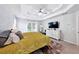 Relaxing primary bedroom features a tray ceiling, natural light, and plush carpet for ultimate comfort and style at 402 Homestead Dr, Dallas, GA 30157