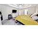 Spacious main bedroom with tray ceiling, television, dresser, and luxury carpet and decor at 402 Homestead Dr, Dallas, GA 30157
