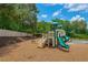 Community playground with a modern playset, slides, and swing at 402 Homestead Dr, Dallas, GA 30157