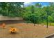 Community playground area featuring swings, and ride-on toys at 402 Homestead Dr, Dallas, GA 30157
