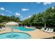 Resort-style community pool with a splash fountain and lounge chairs at 402 Homestead Dr, Dallas, GA 30157