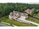 Stunning aerial view of a beautiful home with a large yard and a lush, green neighborhood at 11 Brownson Ct, Acworth, GA 30101