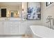 Stylish bathroom features white cabinets, soaking tub, and chrome fixtures at 11 Brownson Ct, Acworth, GA 30101