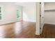 Bright bedroom features hardwood floors, crown molding, closet and a window looking out onto a lush green landscape at 11 Brownson Ct, Acworth, GA 30101
